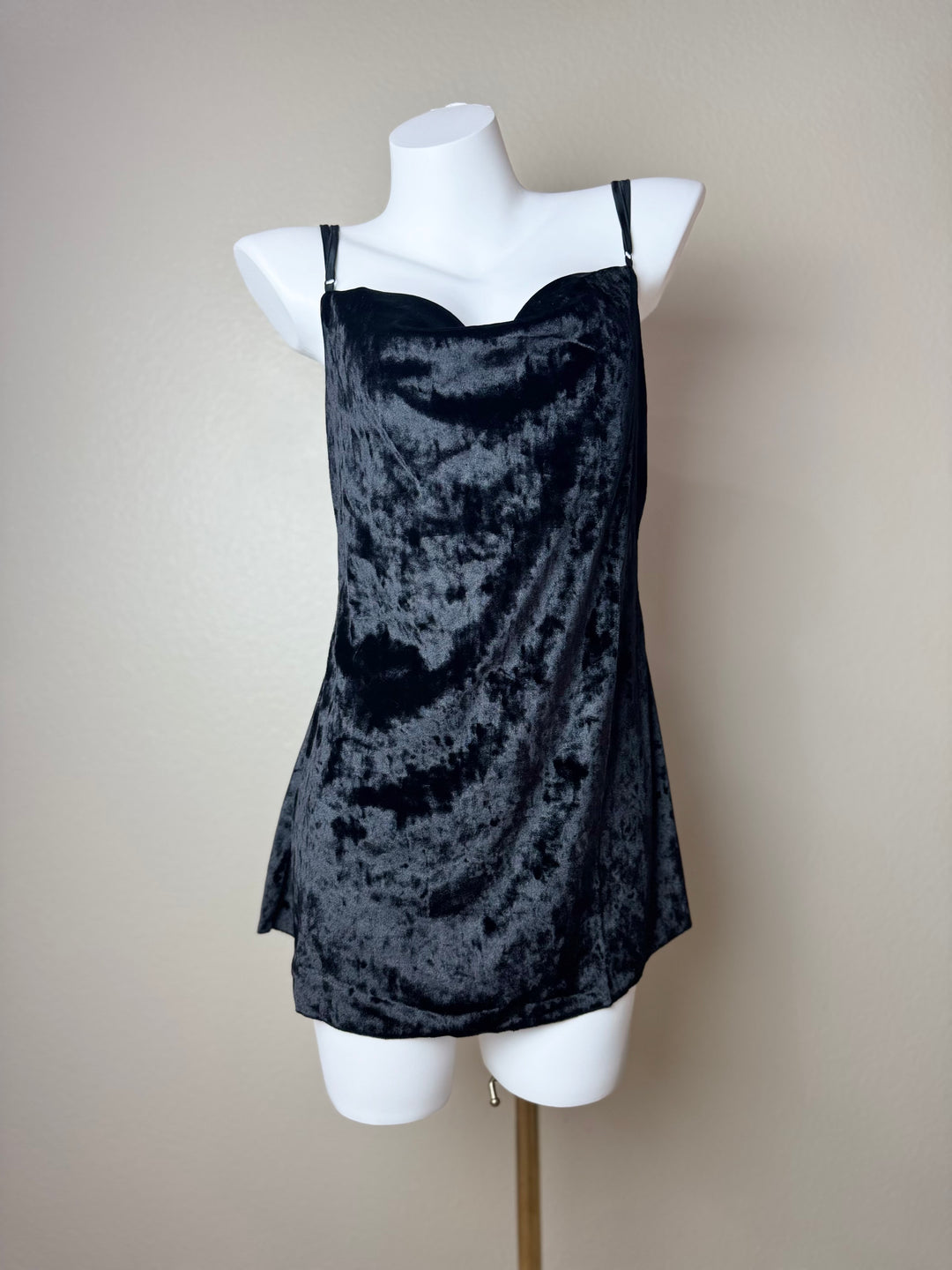 front of a black Velvet Butterfly Back Slip dress on a mannequin against a beige background