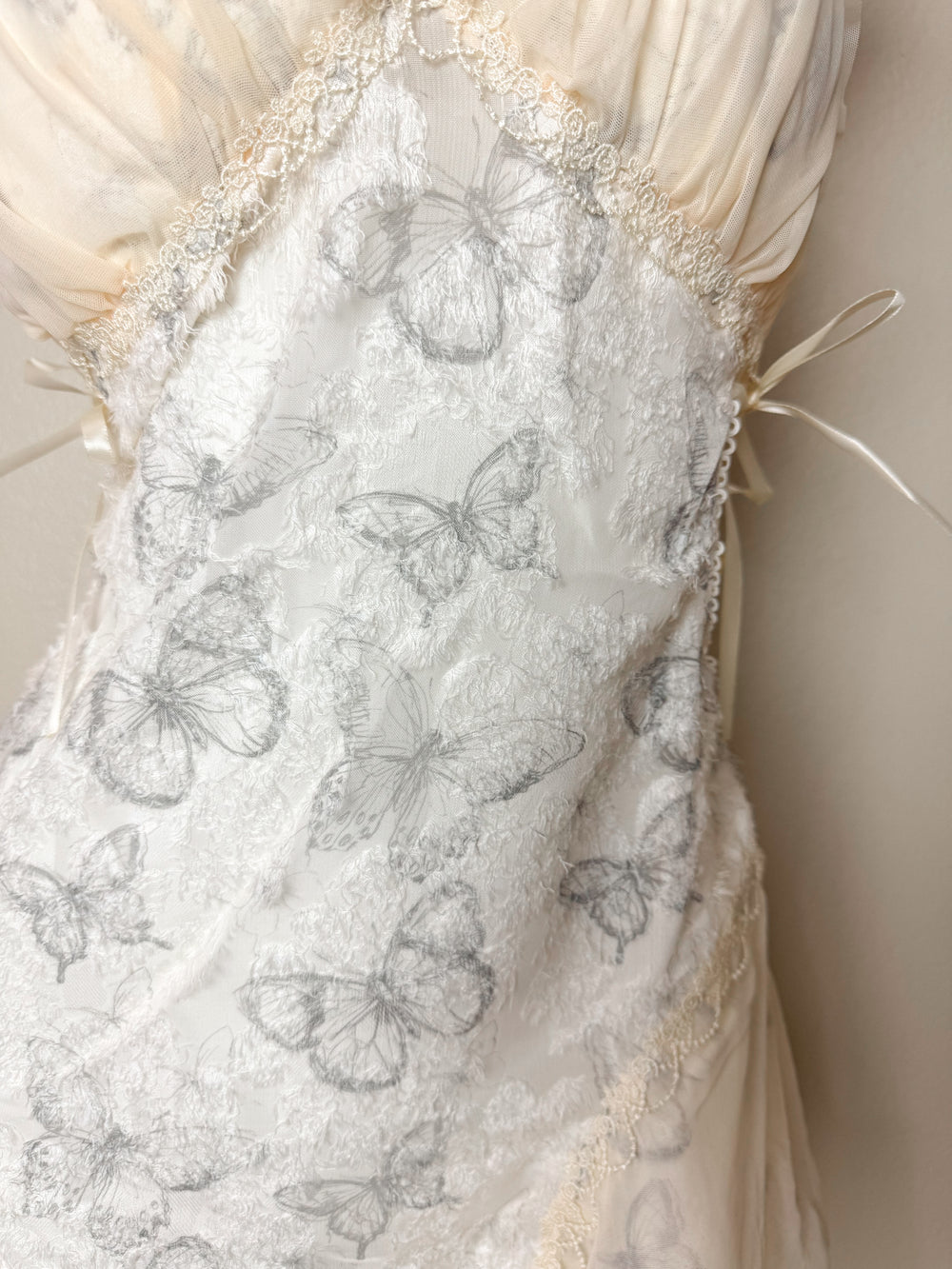 Close up of Butterfly Embroidered Crisscross Slip